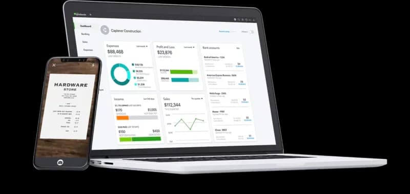 Laptop and mobile showing QuickBooks software